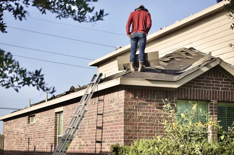 Professional roofer working on a residential roof in Downtown Oceanside